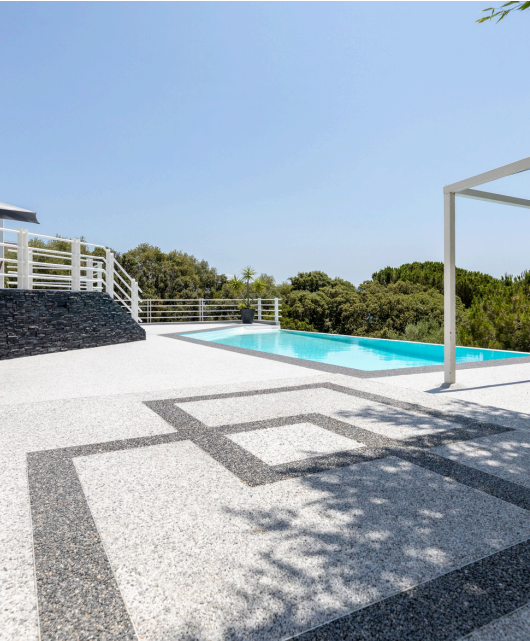 Luxury pool deck finished with ForteCast aggregate surfacing